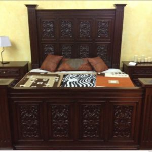 Carved hardwood and upholstered bed set